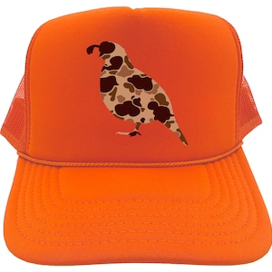 May include: Orange trucker hat with a camouflage quail design. The hat has a mesh back and a curved brim.