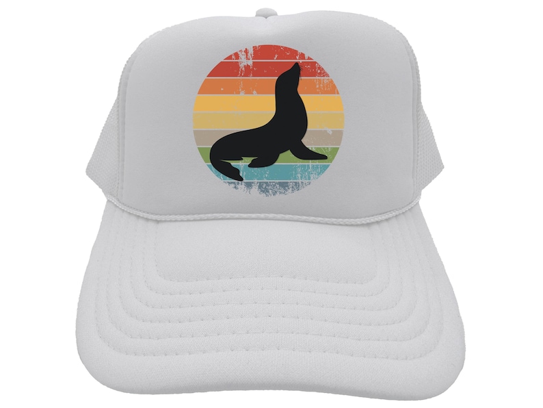 May include: White trucker hat with a retro-style graphic of a seal in front of a rainbow sunset.