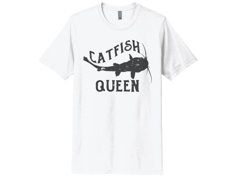 May include: White t-shirt with a black graphic of a catfish and the text "Catfish Queen".
