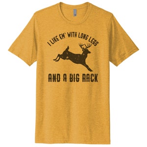 May include: A yellow t-shirt with a brown deer silhouette and the text "I like 'em with long legs and a big rack".