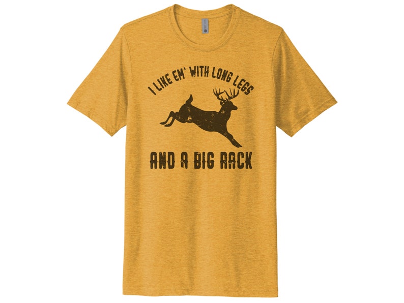 May include: A yellow t-shirt with a brown deer silhouette and the text "I like 'em with long legs and a big rack".