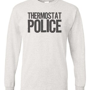 May include: A heather grey long-sleeved t-shirt with the text "THERMOSTAT POLICE" printed in black.