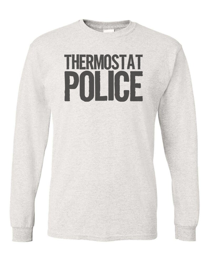 May include: A heather grey long-sleeved t-shirt with the text "THERMOSTAT POLICE" printed in black.