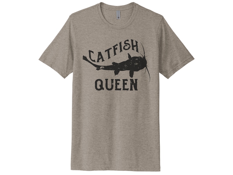 May include: A heather grey t-shirt with a black graphic of a catfish and the text "Catfish Queen".