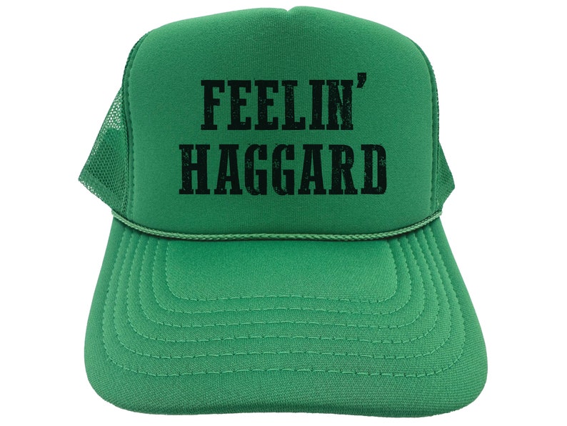 May include: Green trucker hat with a black embroidered design that says "Feelin' Haggard".