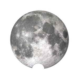 May include: A detailed image of the moon, showcasing its textured surface and craters. The moon is depicted in shades of gray and white, with a circular shape and a small cutout at the bottom. The image is set against a plain white background.