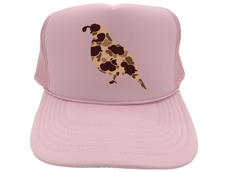 May include: A pink trucker hat with a camouflage quail design. The hat has a mesh back and a curved brim.