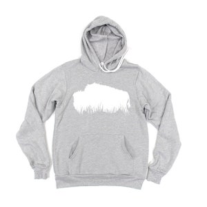 May include: A heather gray hoodie with a white graphic on the front. The hoodie has a drawstring hood, a front pocket, and long sleeves. The white graphic appears to be a stylized cloud or landscape.