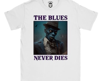 Può includere: Maglietta bianca con uno zombie blu che suona la chitarra. Il testo "The Blues Never Dies" è stampato sulla maglietta.