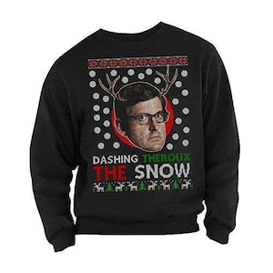 May include: Black Christmas sweater with a red and green design. The sweater features a man's face with reindeer antlers and the text "Dashing Theroux The Snow".