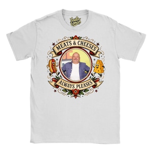 May include: White t-shirt with a circular design. The design features the text "MEATS & CHEESES ALWAYS PLEASES", a cartoon image of a man, a hot dog, and a cheese wedge.