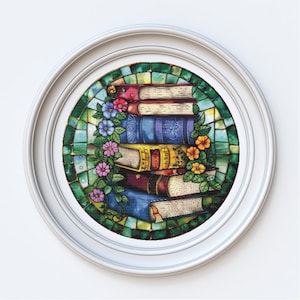 May include: A framed artwork depicting a stack of books with colourful covers, decorated with flowers and vines, set against a stained-glass background. The frame is white. The books have red, blue, and yellow covers.