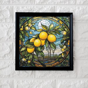 May include: A stained glass style artwork depicting a lemon tree with yellow lemons and green leaves. The background is a blue sky with a white sun and a landscape with trees.