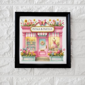May include: A framed watercolor print of a pink shop with the text "PETALS & PASTELS". The shop is decorated with flowers, a butterfly, and a dress form in the window. The shop has a striped awning and a door with a floral wreath.