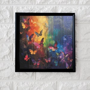 Puede incluir: Una impresión en lienzo enmarcada que presenta una pintura abstracta colorida de mariposas con un fondo degradado de arcoíris.