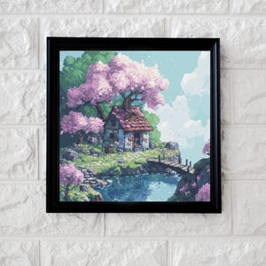Peut inclure: Une impression d'art encadrée représentant un paysage serein avec un petit chalet au bord de l'eau. La scène est dominée par un grand arbre rose en fleurs, avec un pont menant au chalet. Le ciel est bleu clair avec des nuages blancs duveteux.