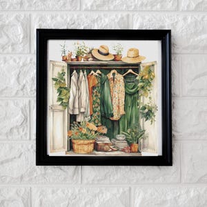May include: A framed watercolor painting of a vintage wooden cabinet with an open door revealing a collection of clothing, hats, and plants. The cabinet is painted green and white, and the clothing is a mix of patterns and colors.