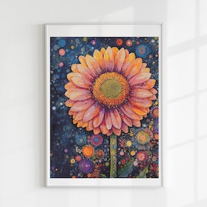 May include: A framed watercolour print featuring a large gerbera daisy. The flower has orange and pink petals and a yellow centre. The background is dark blue with colourful, abstract shapes. The artwork is displayed on a white wall.