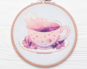 May include: A pink teacup with a swirling purple and pink design inside, with steam rising from the top. The teacup is on a saucer with purple flowers and stars.
