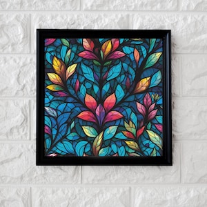 May include: Framed art print with a floral design. The artwork displays a mosaic of leaves and flowers in shades of blue, red, yellow, and green. The black frame provides a contrasting border to the vibrant image.