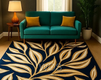 May include: A navy blue area rug with a botanical leaf design in beige and cream tones. The rug is placed in a living room setting with a teal sofa, yellow pillows, and a wooden side table with a lamp.