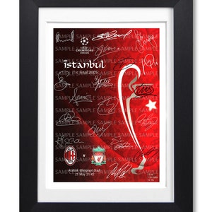 May include: A framed print of the 2005 UEFA Champions League Final in Istanbul, Turkey. The print features the signatures of the players from both teams, AC Milan and Liverpool, as well as the date and location of the match. The print is framed in black and has a white mount.