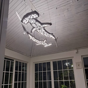 Сeiling chandelier with 2 hammerhead sharks in Maori surfing style