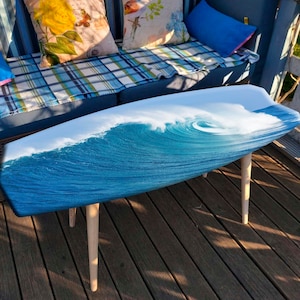 Surfboard coffee table with ocean wave