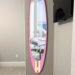 Wall mirror in surfboard shaped frame