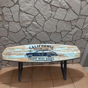 Surfboard shaped bench with the image of a tourist car