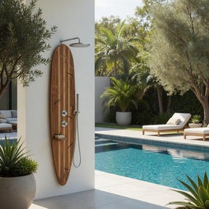 May include: An outdoor shower system mounted on a vertical wooden surfboard panel. The unit features a circular overhead shower head, a handheld shower wand, two round control knobs, and a small integrated shelf, all finished in polished chrome.