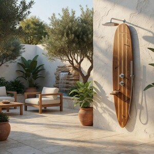 May include: An outdoor shower system mounted on a vertical wooden surfboard-shaped panel. The unit features a stainless steel overhead shower head, two circular control knobs, a handheld shower wand, and a small shelf attached to the wood surface.