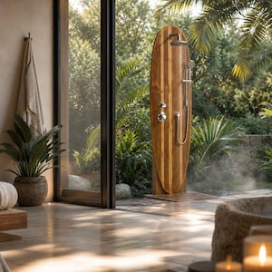 May include: An outdoor shower unit featuring a tall, surfboard-shaped wooden panel with a chrome rainfall showerhead, a handheld shower attachment, and circular metal control knobs, positioned on a stone floor near a large glass door.