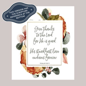 Può includere: Una stampa floreale ad acquerello con una cornice dorata e il testo "Give thanks to the Lord for He is good. His steadfast love endures forever. Psalm 107:1".