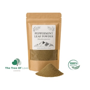 May include: A brown kraft paper stand-up pouch containing peppermint leaf powder. The white label features the text PEPPERMINT LEAF POWDER (Mentha piperita), a mountain graphic, and the website www.treeoflove.shop. A pile of the green powder sits in front.