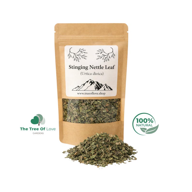 May include: A brown paper pouch containing dried Stinging Nettle Leaf (Urtica dioica) with a clear window showing the green herbs. The label features a mountain graphic, the text www.treeoflove.shop, and a 100% natural logo with two leaves.