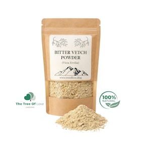 May include: A brown kraft paper stand-up pouch containing beige bitter vetch powder, labeled with the text BITTER VETCH POWDER (Vicia Ervilia) and a mountain graphic. A small pile of the same light-colored powder sits in front of the pouch.