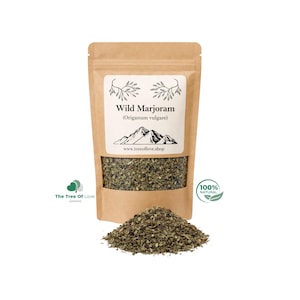 May include: A brown kraft paper pouch containing dried Wild Marjoram (Origanum vulgare) with a clear window showing the green herb. The label features a mountain graphic and the text www.treeoflove.shop, with a pile of the herb in front.