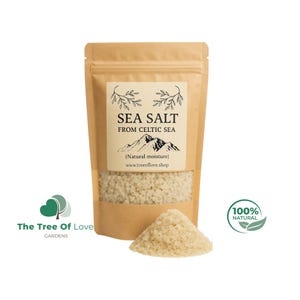 May include: A kraft paper bag of sea salt from the Celtic Sea, with a clear window showing the coarse salt. The label reads "SEA SALT FROM CELTIC SEA" with a mountain graphic. A small pile of salt sits in front of the bag. The text "100% NATURAL" is also visible.