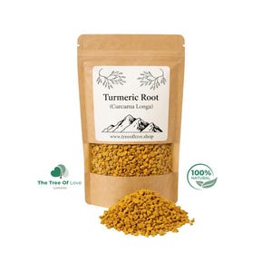May include: A brown kraft paper pouch containing yellow turmeric root granules. The label features a mountain graphic, the text "Turmeric Root (Curcuma Longa)", and "www.treeoflove.shop". A pile of the yellow granules sits in front of the pouch.