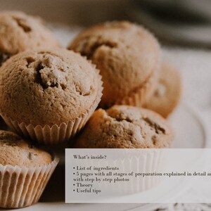 May include: A close-up of a stack of freshly baked muffins, with a light brown color and a slightly rough texture. The muffins are arranged in a pyramid shape, with the top muffin being the largest. The muffins are in paper liners, and the image is taken from a slightly elevated angle.