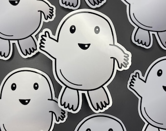 Könnte beinhalten: Ein Set mit zehn weißen Vinyl-Aufklebern mit Comicfiguren mit Kulleraugen und lächelnden Mündern. Die Figuren haben verschiedene Posen und Gesichtsausdrücke.