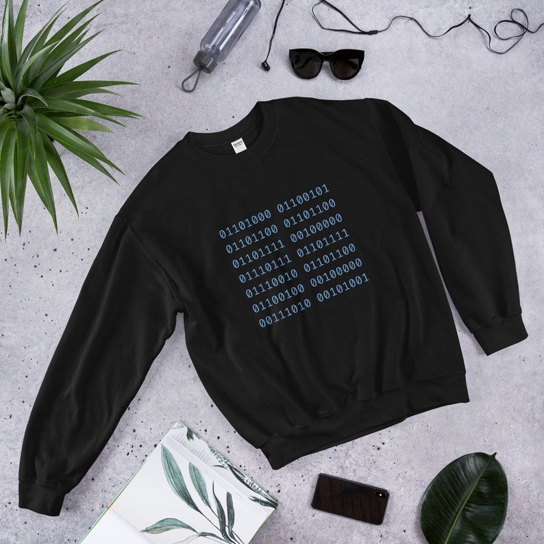 May include: Black sweatshirt with a blue graphic of a series of binary code numbers.