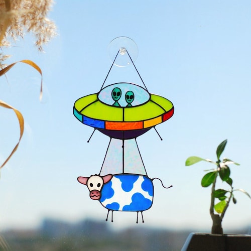 UFO cow stained glass suncatcher funny handmade window decor. Alien abduction stained glass window hangings unique gift for sci-fi fans