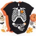 Amanda Judnic reviewed TRIPLETS Skeleton Maternity Halloween t-shirt - halloween pregnancy shirt - halloween t-shirt - pregnancy announcement - halloween maternity