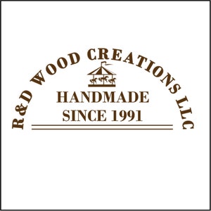 May include: Brown logo with the text "R&D Wood Creations LLC" in an arc above a carousel with horses and the text "Handmade Since 1991" below.