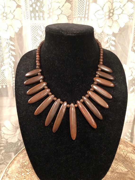 Mid Century Cleopatra style bib wood/resin 19.5” n