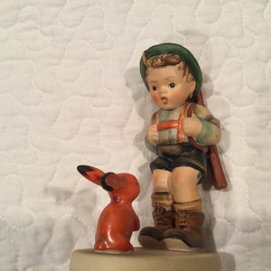 Hummel “Sensitive Hunter”, Boy with rabbit, Rare crossed suspenders, 5”