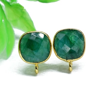 May include: A pair of gold-toned earrings with green gemstone square-shaped drops. The earrings have a simple design and are perfect for everyday wear.