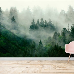 May include: A misty forest scene with tall evergreen trees, creating a serene and tranquil atmosphere. The fog adds a sense of mystery and depth to the image.